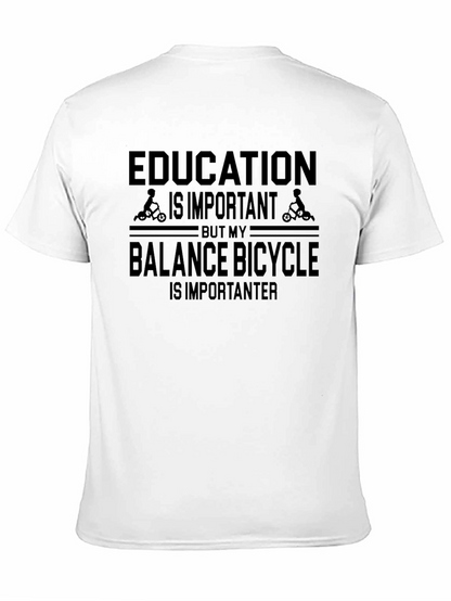 Camiseta Negra: Educación vs. Bicicleta de Equilibrio